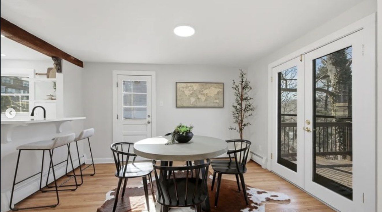 Finished dining room with breakfast bar and French doors